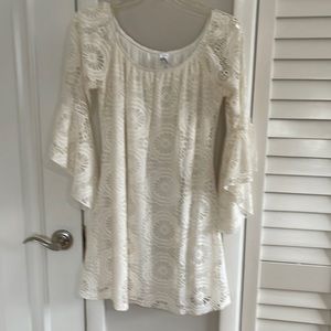 Cream lace dress with flared sleeves.